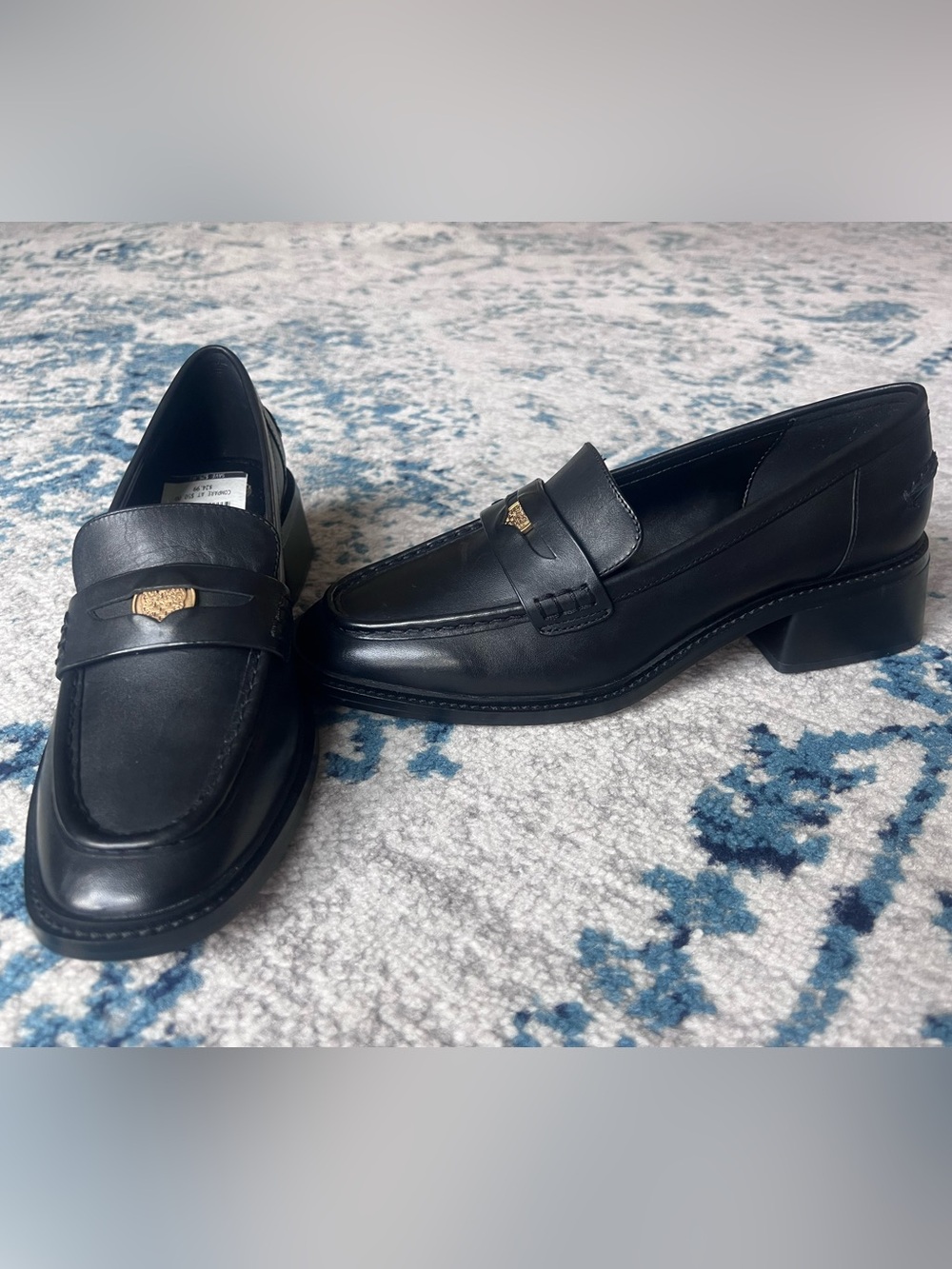 Vince Camuto Black Leather Slip-On with Gold Crest Detail